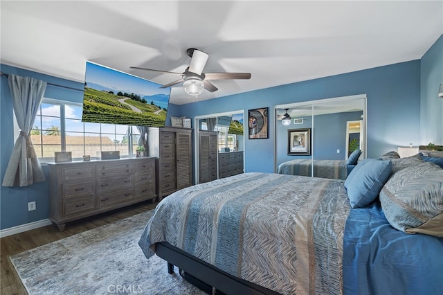 6963 Shamrock Ln, Rancho Cucamonga, CA 91701 - bedroom with wood finished floors, ceiling fan, and multiple closets