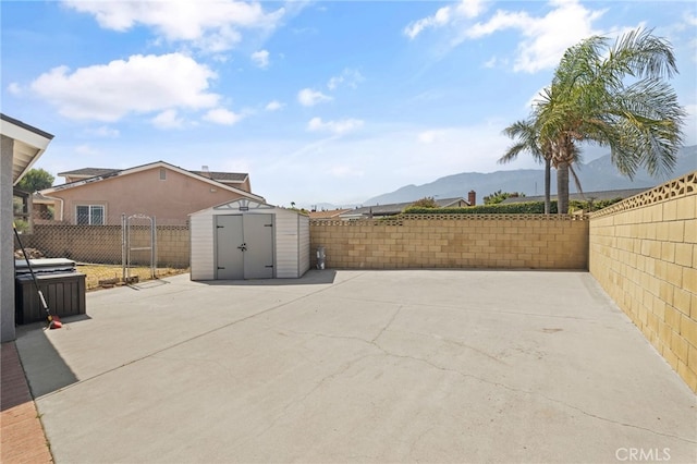 6963 Shamrock Ln, Rancho Cucamonga, CA 91701 - fenced backyard with a patio, a storage shed, and a mountain view