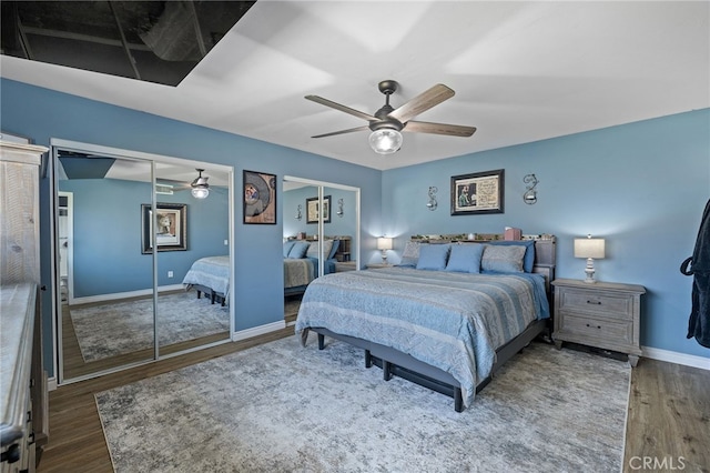 6963 Shamrock Ln, Rancho Cucamonga, CA 91701 - bedroom featuring multiple closets, wood finished floors, and ceiling fan