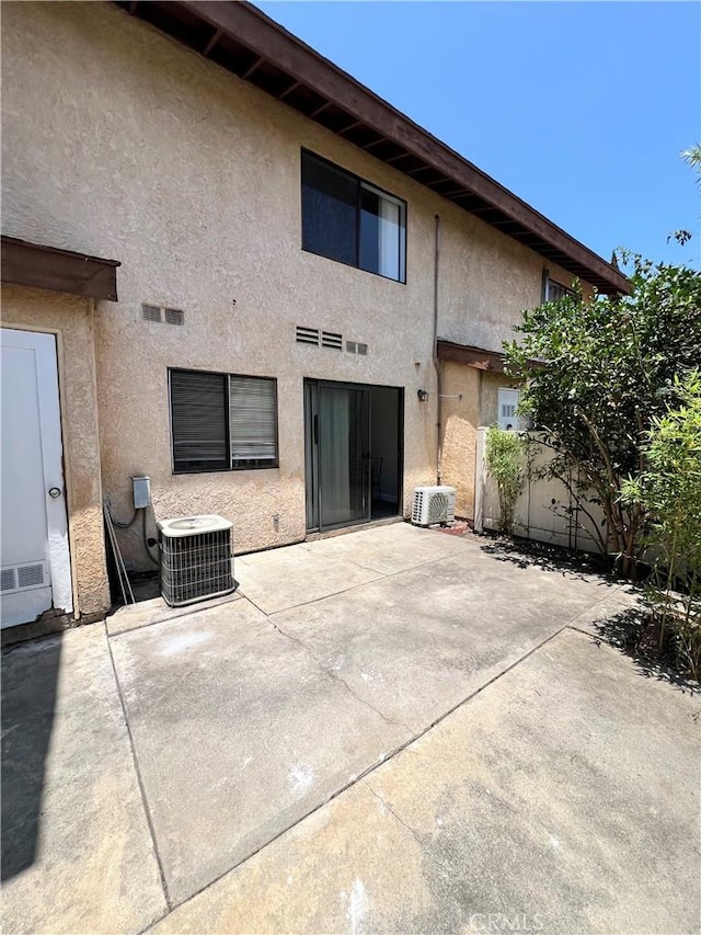1231 S Golden W Ave Unit 24, Arcadia, CA 91007 - back of property with stucco siding and a patio area