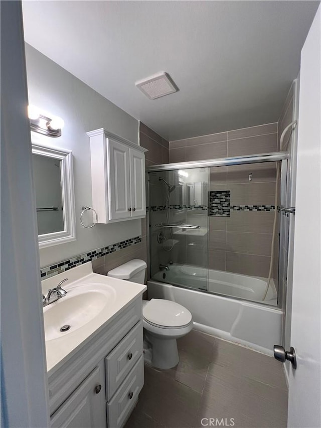 1231 S Golden W Ave Unit 24, Arcadia, CA 91007 - bathroom featuring vanity, combined bath / shower with glass door, tile patterned floors, and backsplash
