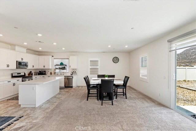 21288 Telegraph Rd, Riverside, CA 92507 - dining space with light colored carpet and recessed lighting