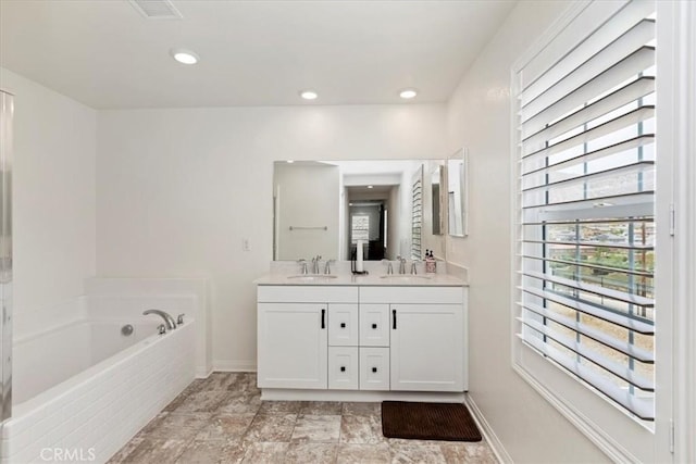 21288 Telegraph Rd, Riverside, CA 92507 - bathroom with double vanity, a garden tub, and recessed lighting
