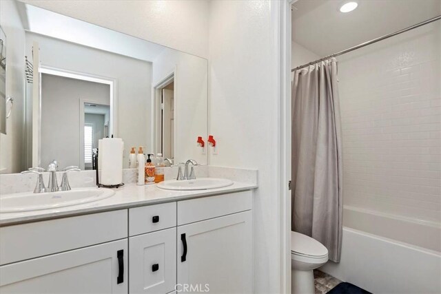 21288 Telegraph Rd, Riverside, CA 92507 - bathroom featuring double vanity and shower / bathtub combination with curtain