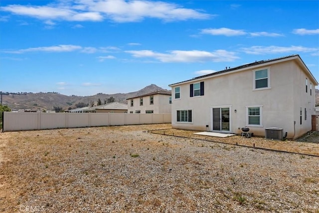 21288 Telegraph Rd, Riverside, CA 92507 - rear view of property featuring a mountain view, stucco siding, and a patio