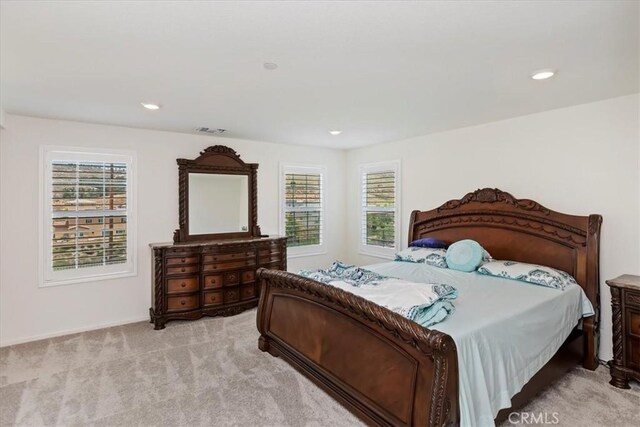 21288 Telegraph Rd, Riverside, CA 92507 - bedroom featuring light carpet, multiple windows, and recessed lighting