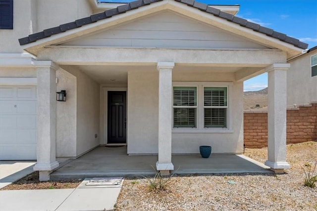 21288 Telegraph Rd, Riverside, CA 92507 - property entrance featuring a garage and stucco siding