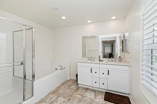 21288 Telegraph Rd, Riverside, CA 92507 - bathroom featuring double vanity, a garden tub, a shower stall, and recessed lighting