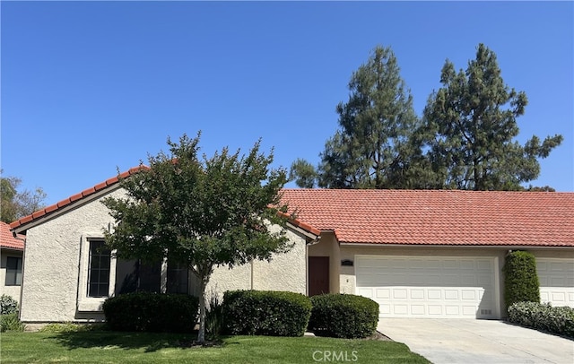 26226 Rainbow Glen Dr, Newhall, CA 91321 - view of front of house featuring a tile roof, a garage, concrete driveway, stucco siding, and a front yard