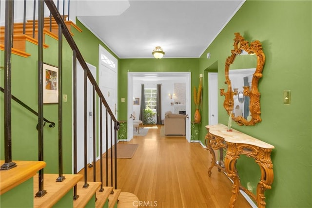 929 E Marshall Pl, Long Beach, CA 90807 - entryway with stairs, wood finished floors, and ornamental molding