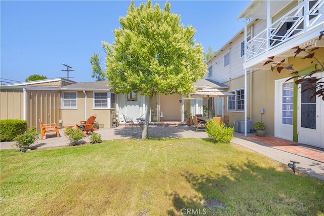929 E Marshall Pl, Long Beach, CA 90807 - back of property with a lawn, a patio area, and stucco siding