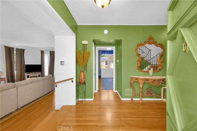 929 E Marshall Pl, Long Beach, CA 90807 - corridor featuring light wood-type flooring and ornamental molding