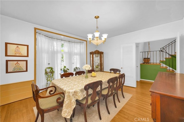 929 E Marshall Pl, Long Beach, CA 90807 - dining area with a chandelier, ornamental molding, light wood-type flooring, and stairs