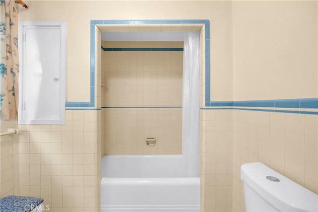 929 E Marshall Pl, Long Beach, CA 90807 - full bathroom with tile walls, shower / tub combo with curtain, and a wainscoted wall