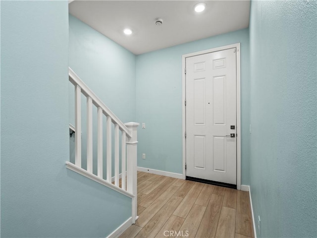 27148 Valley Oak Pl, Valencia, CA 91381 - foyer entrance featuring light wood-style floors, stairs, and recessed lighting
