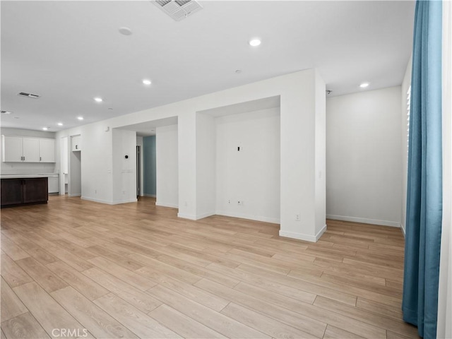 27148 Valley Oak Pl, Valencia, CA 91381 - unfurnished living room with light wood-style flooring and recessed lighting