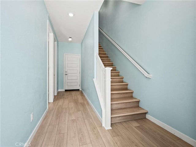 27148 Valley Oak Pl, Valencia, CA 91381 - staircase with wood finished floors and baseboards