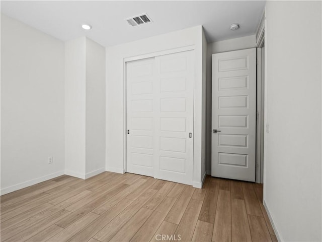 27148 Valley Oak Pl, Valencia, CA 91381 - unfurnished bedroom featuring light wood finished floors, a closet, and recessed lighting