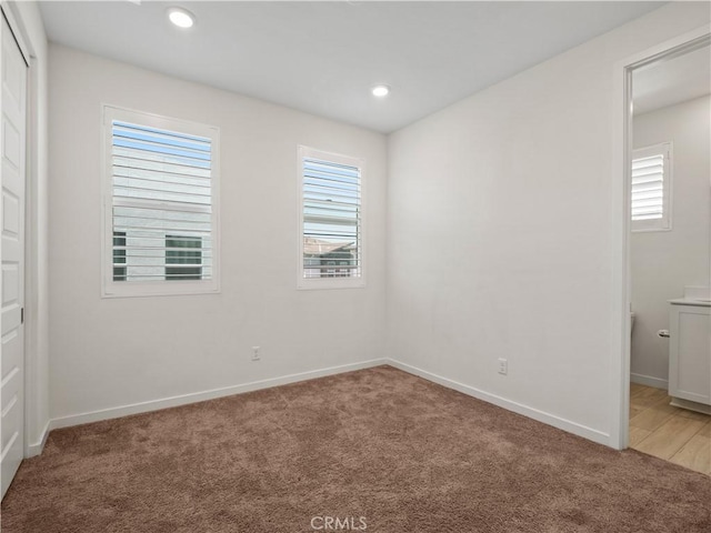27148 Valley Oak Pl, Valencia, CA 91381 - unfurnished bedroom with light colored carpet, recessed lighting, and a closet