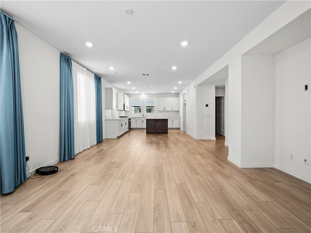 27148 Valley Oak Pl, Valencia, CA 91381 - unfurnished living room with light wood-type flooring and recessed lighting