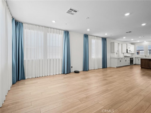 27148 Valley Oak Pl, Valencia, CA 91381 - unfurnished living room with light wood finished floors and recessed lighting