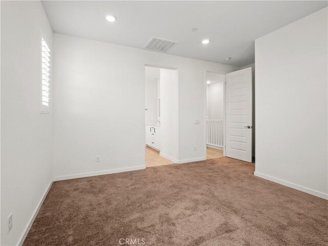 27148 Valley Oak Pl, Valencia, CA 91381 - unfurnished bedroom with light colored carpet, ensuite bathroom, and recessed lighting