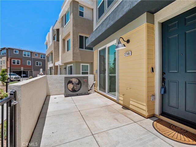 27148 Valley Oak Pl, Valencia, CA 91381 - property entrance featuring stucco siding, a balcony, and a residential view