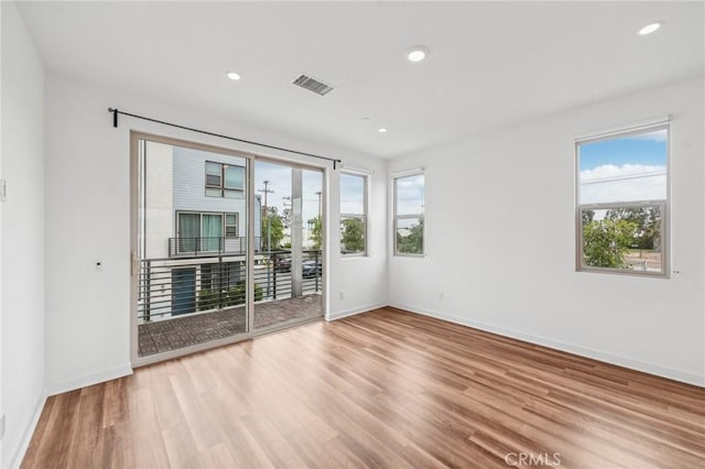 301 Placemark, Irvine, CA 92614 - unfurnished room with healthy amount of natural light, wood finished floors, and recessed lighting