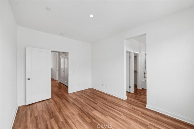 301 Placemark, Irvine, CA 92614 - unfurnished room featuring light wood-style floors and recessed lighting