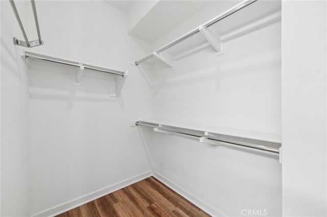301 Placemark, Irvine, CA 92614 - spacious closet featuring dark wood-type flooring