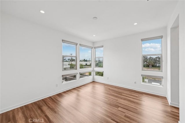 301 Placemark, Irvine, CA 92614 - spare room with plenty of natural light, wood finished floors, and recessed lighting