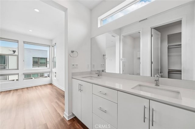 301 Placemark, Irvine, CA 92614 - full bathroom with wood finished floors, double vanity, and recessed lighting
