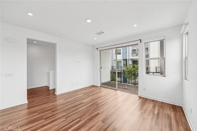 301 Placemark, Irvine, CA 92614 - spare room featuring wood finished floors and recessed lighting