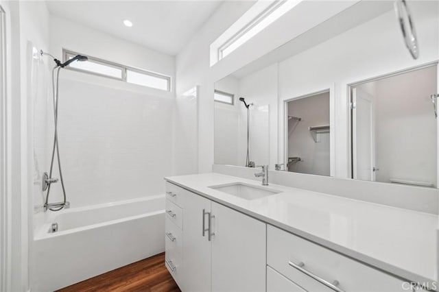 301 Placemark, Irvine, CA 92614 - full bath with vanity, bathing tub / shower combination, wood finished floors, a spacious closet, and recessed lighting