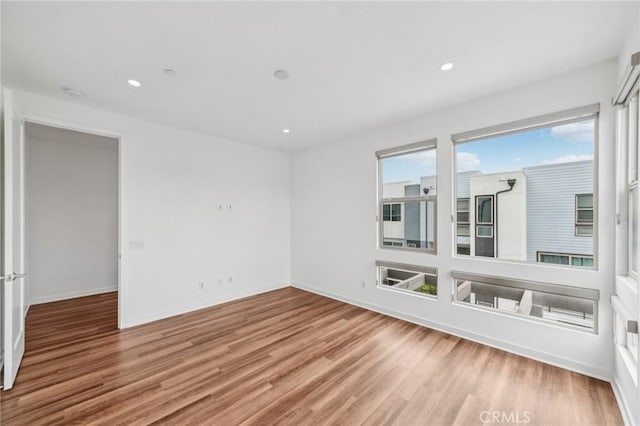 301 Placemark, Irvine, CA 92614 - spare room featuring wood finished floors, recessed lighting, and a smoke detector