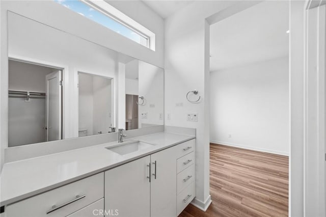 301 Placemark, Irvine, CA 92614 - bathroom featuring vanity and wood finished floors