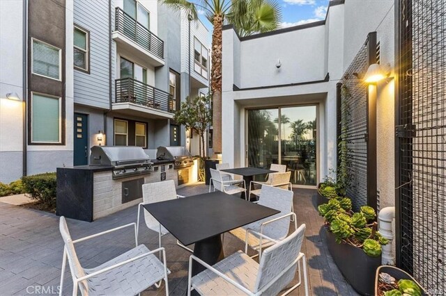 301 Placemark, Irvine, CA 92614 - view of patio with an outdoor kitchen and outdoor dining area