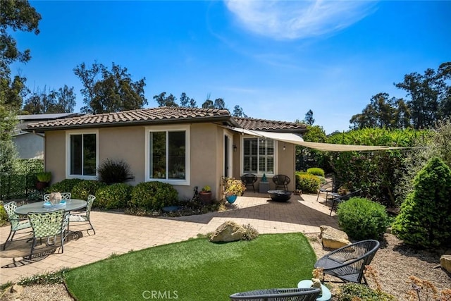 1012 Maggie Ln, Nipomo, CA 93444 - back of house with a patio, stucco siding, a tiled roof, and solar panels