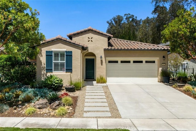 1012 Maggie Ln, Nipomo, CA 93444 - mediterranean / spanish-style house with stucco siding, a tiled roof, an attached garage, and concrete driveway