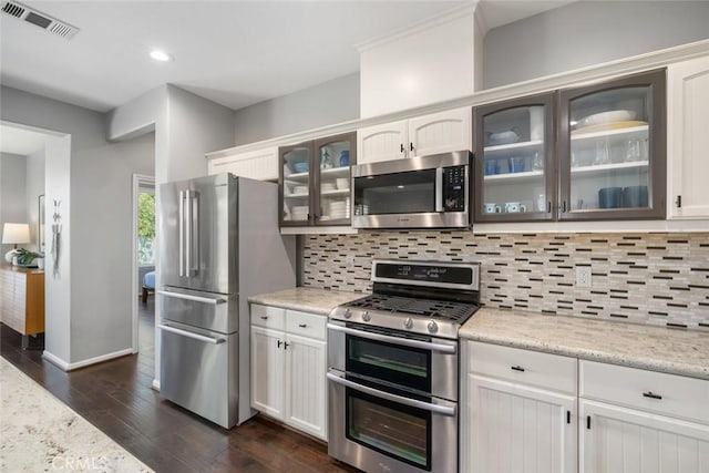 1012 Maggie Ln, Nipomo, CA 93444 - kitchen with appliances with stainless steel finishes, tasteful backsplash, dark wood-type flooring, white cabinets, and recessed lighting