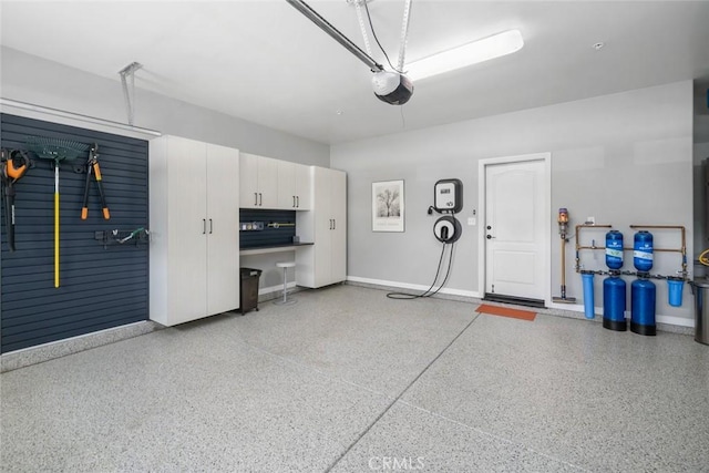 1012 Maggie Ln, Nipomo, CA 93444 - garage with baseboards and a garage door opener