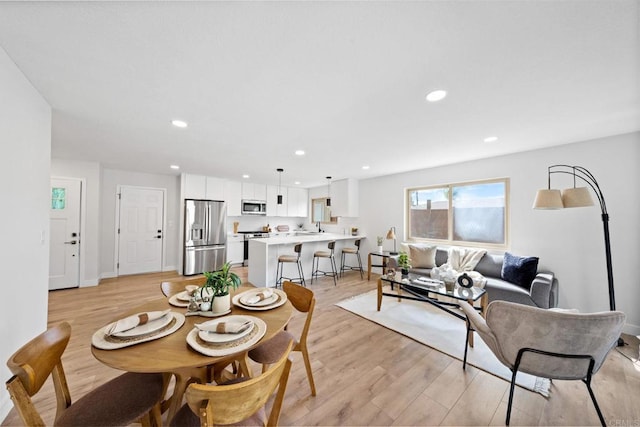 9121 Heatherdale St, Santee, CA 92071 - dining room featuring light wood-style flooring and recessed lighting