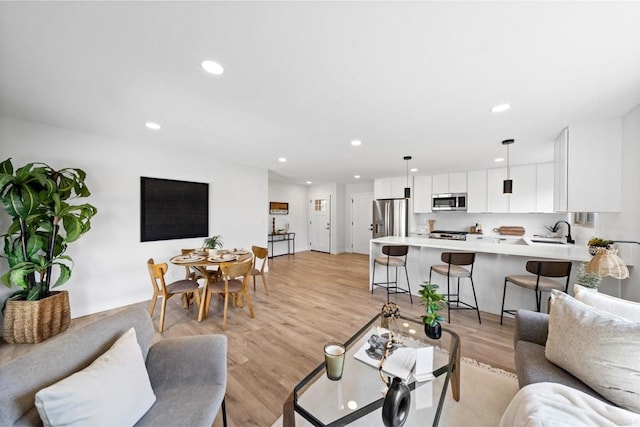 9121 Heatherdale St, Santee, CA 92071 - living room with light wood finished floors and recessed lighting