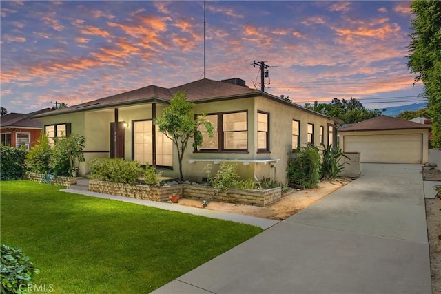 722 E 19th St, San Bernardino, CA 92404 - single story home with a lawn, stucco siding, and a detached garage