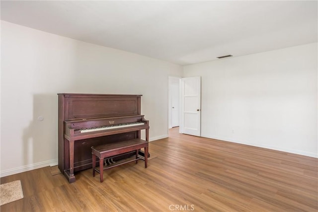 722 E 19th St, San Bernardino, CA 92404 - living area featuring light wood-type flooring and baseboards