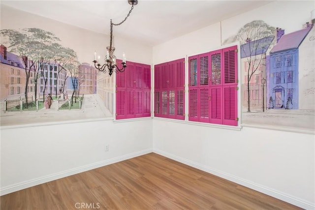 722 E 19th St, San Bernardino, CA 92404 - unfurnished dining area with wood finished floors and a chandelier