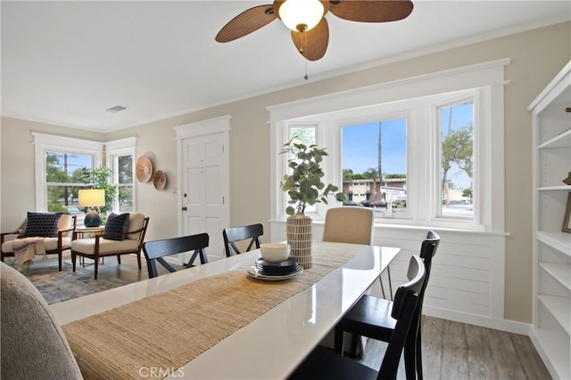 4841 E Los Coyotes Diagonal, Long Beach, CA 90815 - dining room featuring light wood-style flooring and a ceiling fan