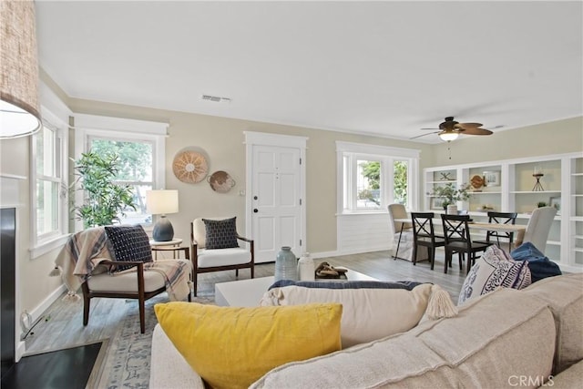 4841 E Los Coyotes Diagonal, Long Beach, CA 90815 - living room featuring wood finished floors and ceiling fan