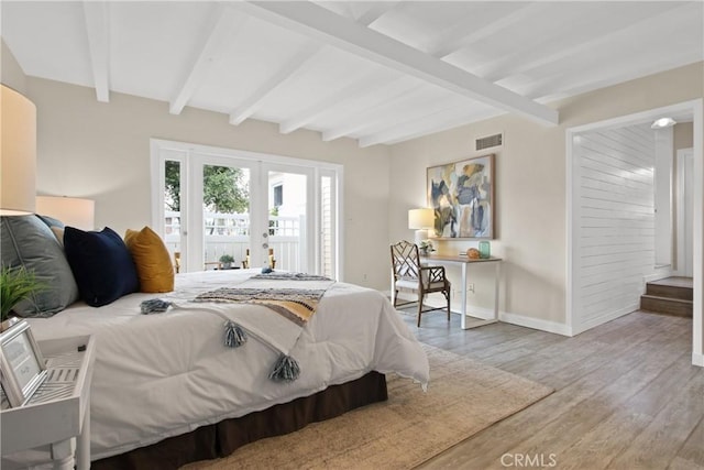 4841 E Los Coyotes Diagonal, Long Beach, CA 90815 - bedroom with wood finished floors, french doors, beam ceiling, and access to exterior