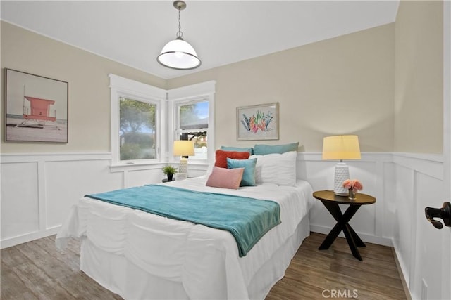 4841 E Los Coyotes Diagonal, Long Beach, CA 90815 - bedroom with a decorative wall, wood finished floors, and wainscoting
